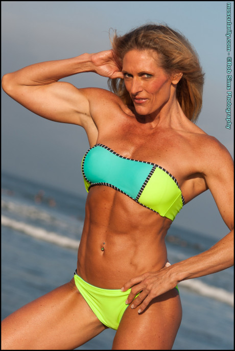 Female bodybuilder Kimberly Dickson poses in a bikini while at the beach - #292345