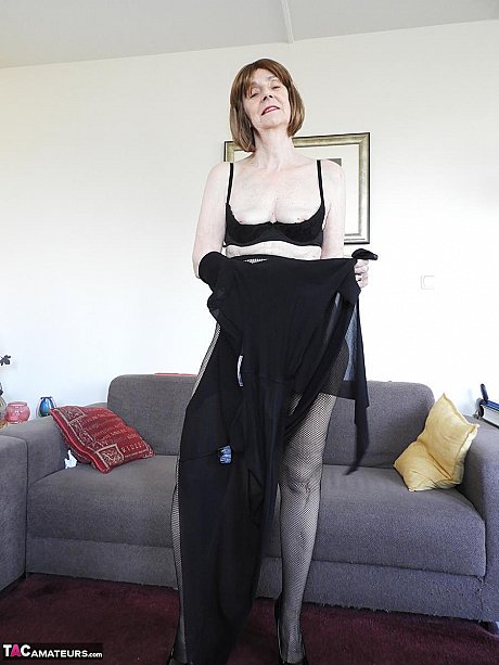 Redheaded grandmother Kat Kitty gets bare naked before inserting a sex toy - Image 6 of 16  in Dildo category   featuring Kat Kitty 