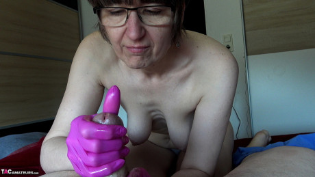 Amateur chick Hotmilf wears latex gloves while giving an oily handjob - #1104676