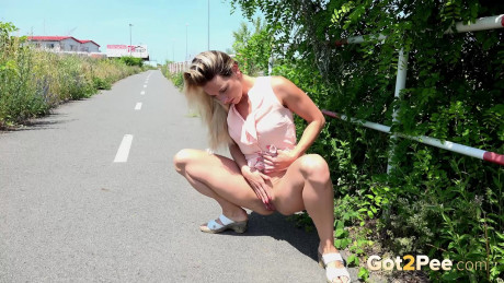 Pretty delicious Bianca hikes her short dress to take a pee on the public walking path - #403762
