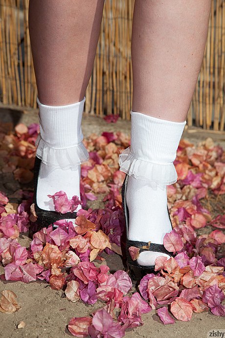 Brunette babe Hannah Kinney flashes her panties while watering plants outdoors - Image 10 of 11  in Legs category   featuring Hannah Kinney 