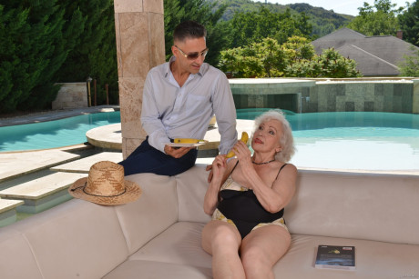 Grey haired grandmother Norma B licks a penis before taking it in her twat poolside - #47079
