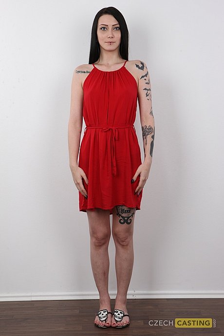 Tattooed brunette with striking eyes removes red dress to stand naked - Image 2 of 20  in Pussy category   featuring Danika 