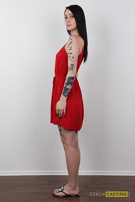 Tattooed brunette with striking eyes removes red dress to stand naked - Image 3 of 20  in Pussy category   featuring Danika 