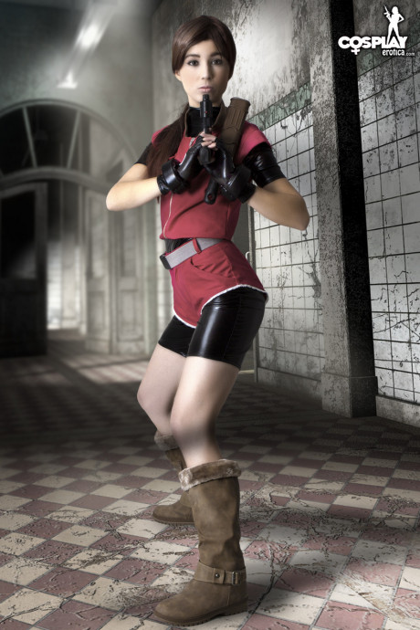 Cosplayer holds her bare ass after wielding a pistol in fingerless gloves - #240129
