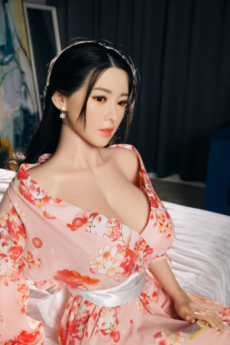 Sensational sex doll Collins shows her amazing cleavage in her long dress - #891383
