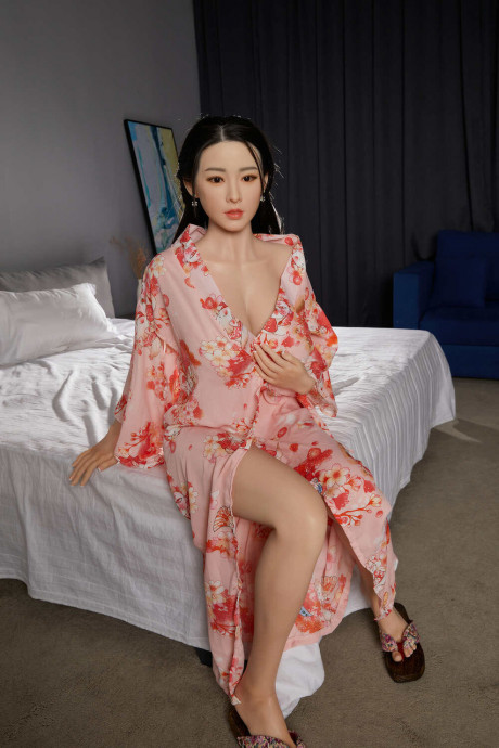 Sensational sex doll Collins shows her amazing cleavage in her long dress - #891385