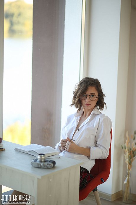 First timer Katrina peers over her glasses prior to getting bareback nude - Image 1 of 20  in Teen category   featuring Katrina 