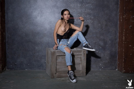 Skinny skank girl chick Dominique Gabrielle works free of ripped jeans to pose naked