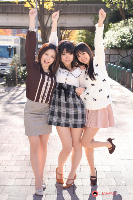 Three Japanese bitches in skirts pose outdoors for a SFW shoot - #1112272