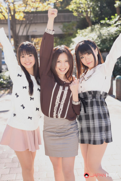 Three Japanese bitches in skirts pose outdoors for a SFW shoot - #1112275