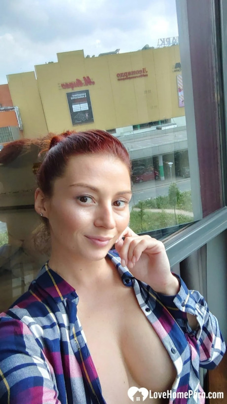Beautiful redhead shows off her gigantic titties & her tattoos while taking nudes - #1349239