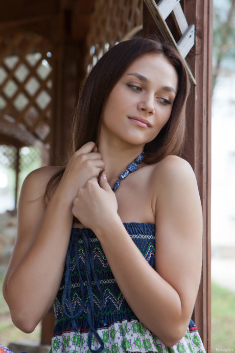 Pretty brunette babe Zlatka exposes her tasty pussy and poses in the park