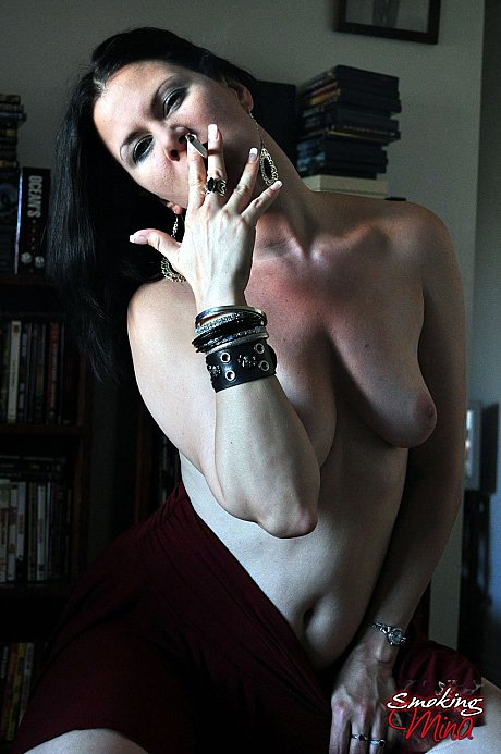 Solo model Mina pets her shaved snatch while smoking a cigarette - Image 5 of 15  in Babe category   featuring Mina 