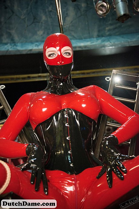 Solo model poses attired from head to toe in latex clothing - Image 15 of 16  in Spreading category  