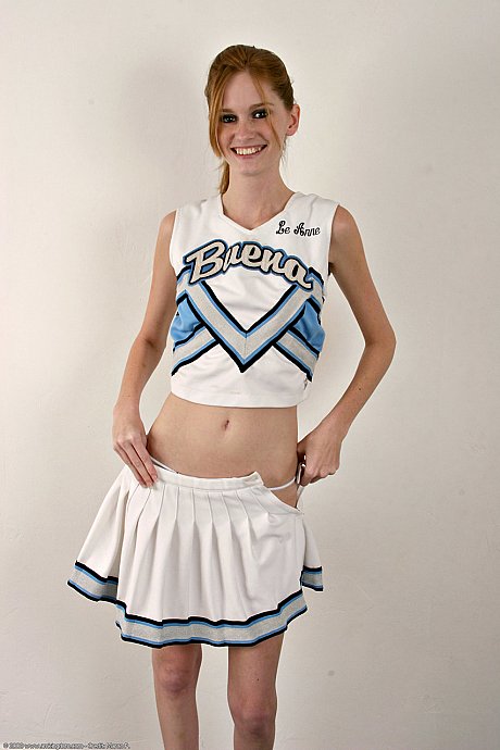 Thin cheerleader Layla Exx unveils her tiny boobies & her trimmed cunt