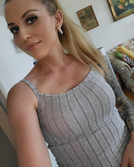 Glamorous babe teases with her juicy tits while showing off her tattoos - #1299387