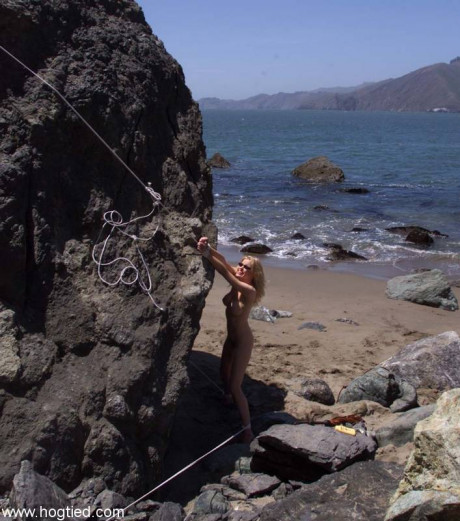 Nude old slave Sadie Belle gets tied to a enormous rock on the beach - #677758