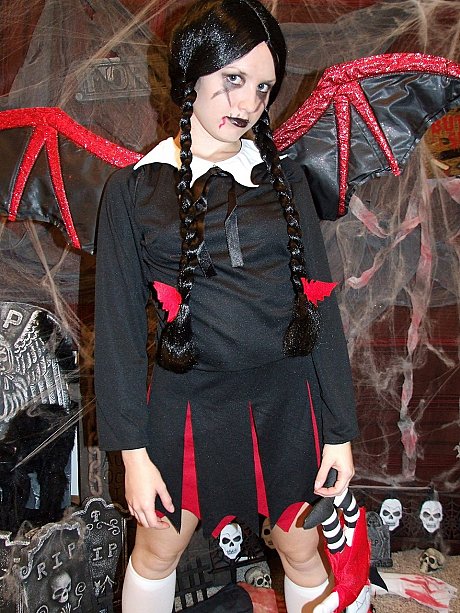 Pigtailed chinese MILF Kitty strips to pose naked in a horror cosplay solo