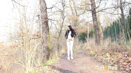 Maddi black squats on a dirt track path to pee - #371853
