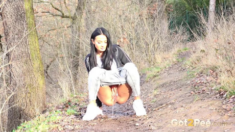 Maddi black squats on a dirt track path to pee - #371855