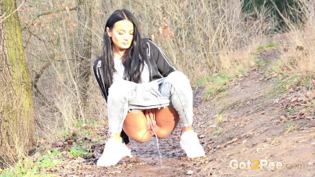 Maddi black squats on a dirt track path to pee - #371856