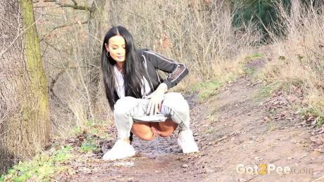 Maddi black squats on a dirt track path to pee - #371863