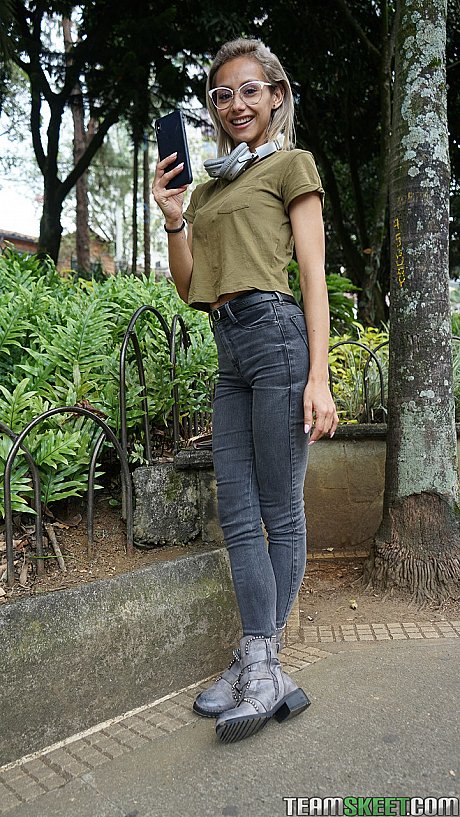 Veronica Leal posing all over her hood in green shirt and tight jeans - Image 10 of 16  in Outdoor category   featuring Veronica Leal 