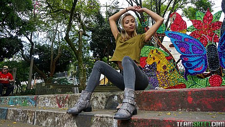 Veronica Leal posing all over her hood in green shirt and tight jeans - Image 11 of 16  in Outdoor category   featuring Veronica Leal 