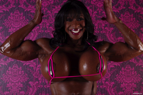 Ebony bodybuilder Yvette Bova looses her enhanced breasts from a bikini - #475037