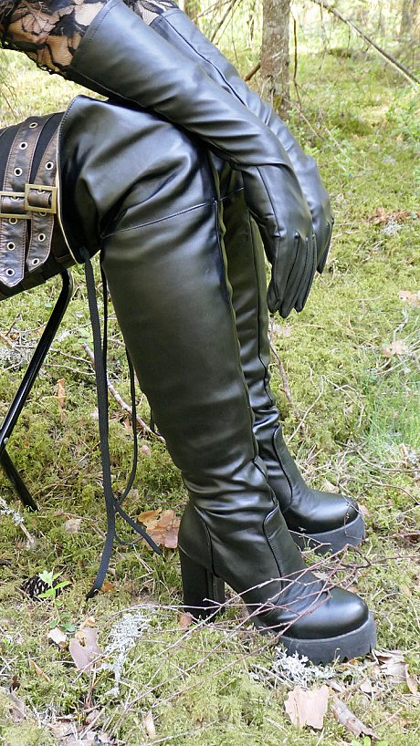 Clothed female wears leather gloves and boots plus shades in the woods - Image 5 of 16  in Close Up category  