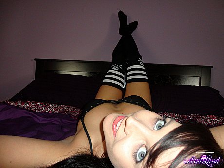 Dark haired young Andi Land gets nude while wearing striped thigh highs - Image 4 of 15  in Pussy category   featuring Andi Land 