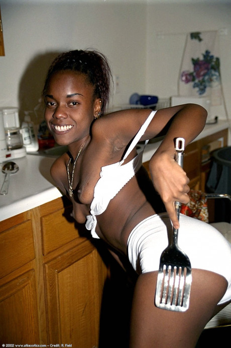 Petite ebony babe Jezebel takes a piss during a pretty striptease - #1228085