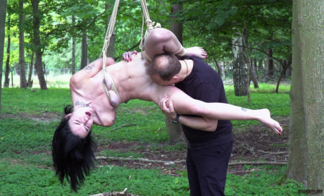 Undressed brunette Crystal Cherry gives a blowjob after being flogged in the woods - #384724