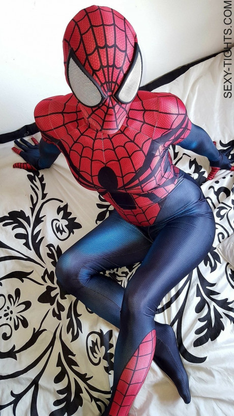 Cosplayer shows off her tight ass in a Spiderman costume on her bed - #173765