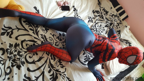 Cosplayer shows off her tight ass in a Spiderman costume on her bed - #173766