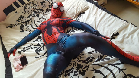Cosplayer shows off her tight ass in a Spiderman costume on her bed - #173770