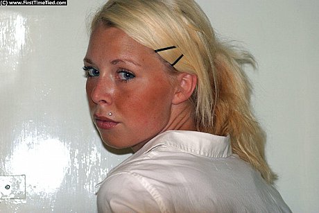 Blondy girl gf lady in a black skirt and white blouse is placed in handcuffs