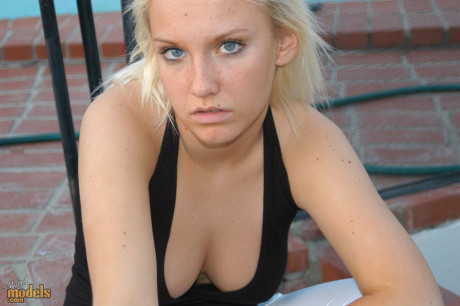 Blonde amateur Jordan smokes a cigarette while showing some cleavage - #1346669