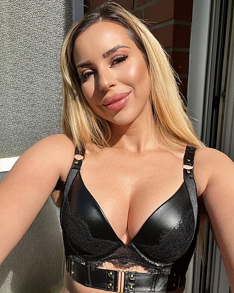 Ravishing yellow-haired amateur poses in hot latex outfits and teases with her curves - Image 1 of 19  in Model category  