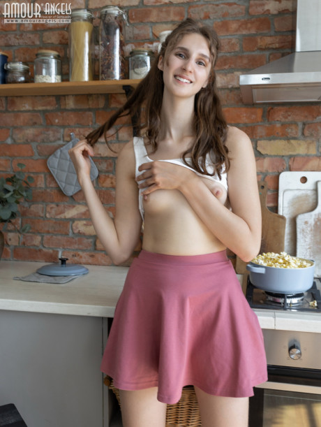 Nice young Milly gets totally naked while cooking food in her kitchen - #1236328