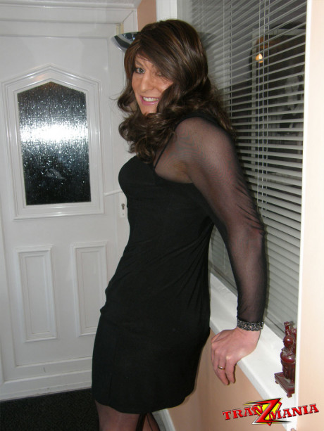 Ravishing brunette crossdresser teasing in a pair of black nylons and matching - #479874