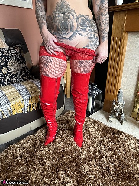Tattooed blondy Inked MILF takes off red latex boots in red leggings - Image 4 of 16  in Pussy category   featuring Inked MILF 