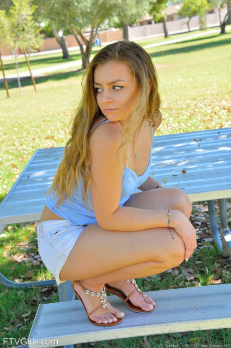 Amateur teen with a gigantic behind Cara spreads her pink muff in the park - #1003780