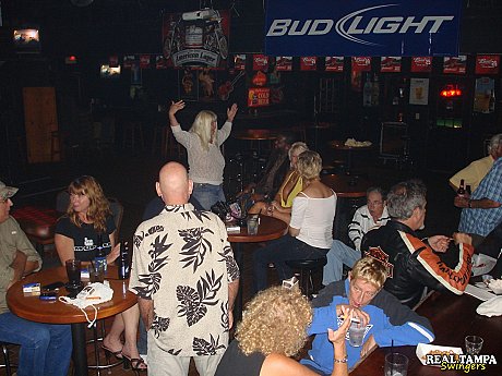 Blondy amateur old shows her shaved clam in the swinger night club