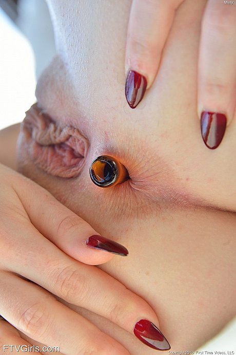 Misty uses a glass dildo to toy her shaved cunt and then mounts her butt - Image 15 of 20  in Pussy category   featuring Misty Lovelace 
