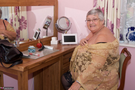 Short haired senior citizen works her breasts and vagina free of undies - #1298519