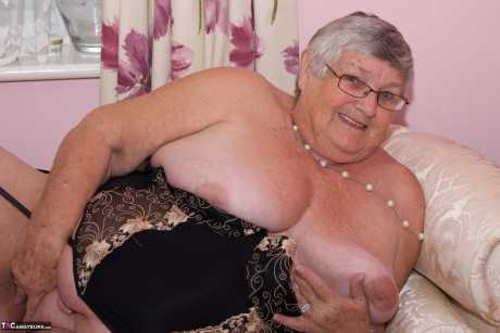 Short haired senior citizen works her breasts and vagina free of undies - #1298525