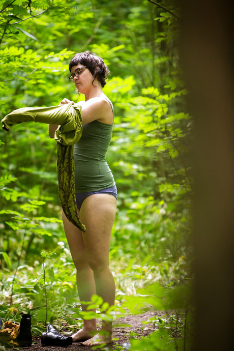 Voyeur snaps of nude brunette skank lady in glasses getting dressed in woods - #468425