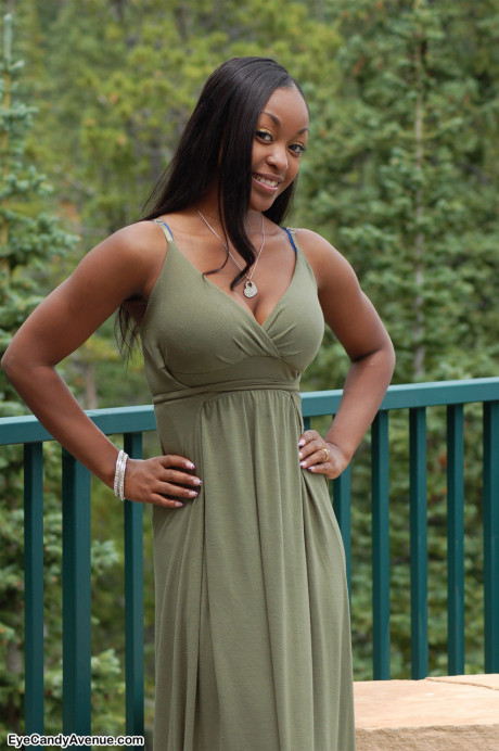 Ebony amateur Amber releases her big breasts from a long dress on a balcony - #156470